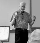 Harry teaching computing to seniors at SeniorNet